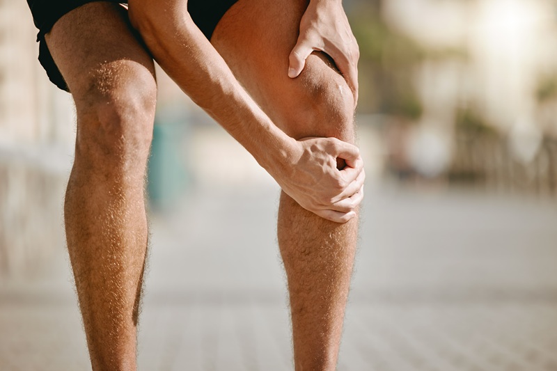 Knee pain of runner or man hands for fitness healthcare risk, muscle accident or training problem