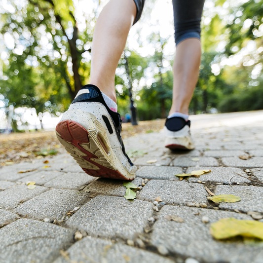 Closeup of joggers feet while in action and running