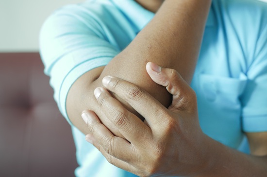 A patient suffering from elbow pain.